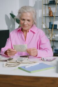 Senior woman looking at nostalgic photo