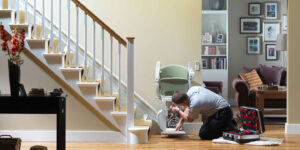 Stair lift technician working on stair lift