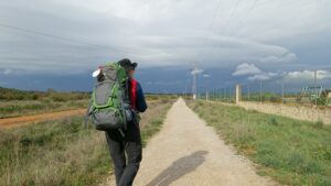 Man walking away wearing backpack