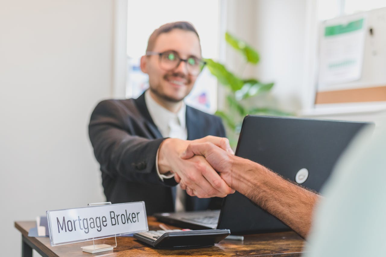Mortgage broker shaking hands