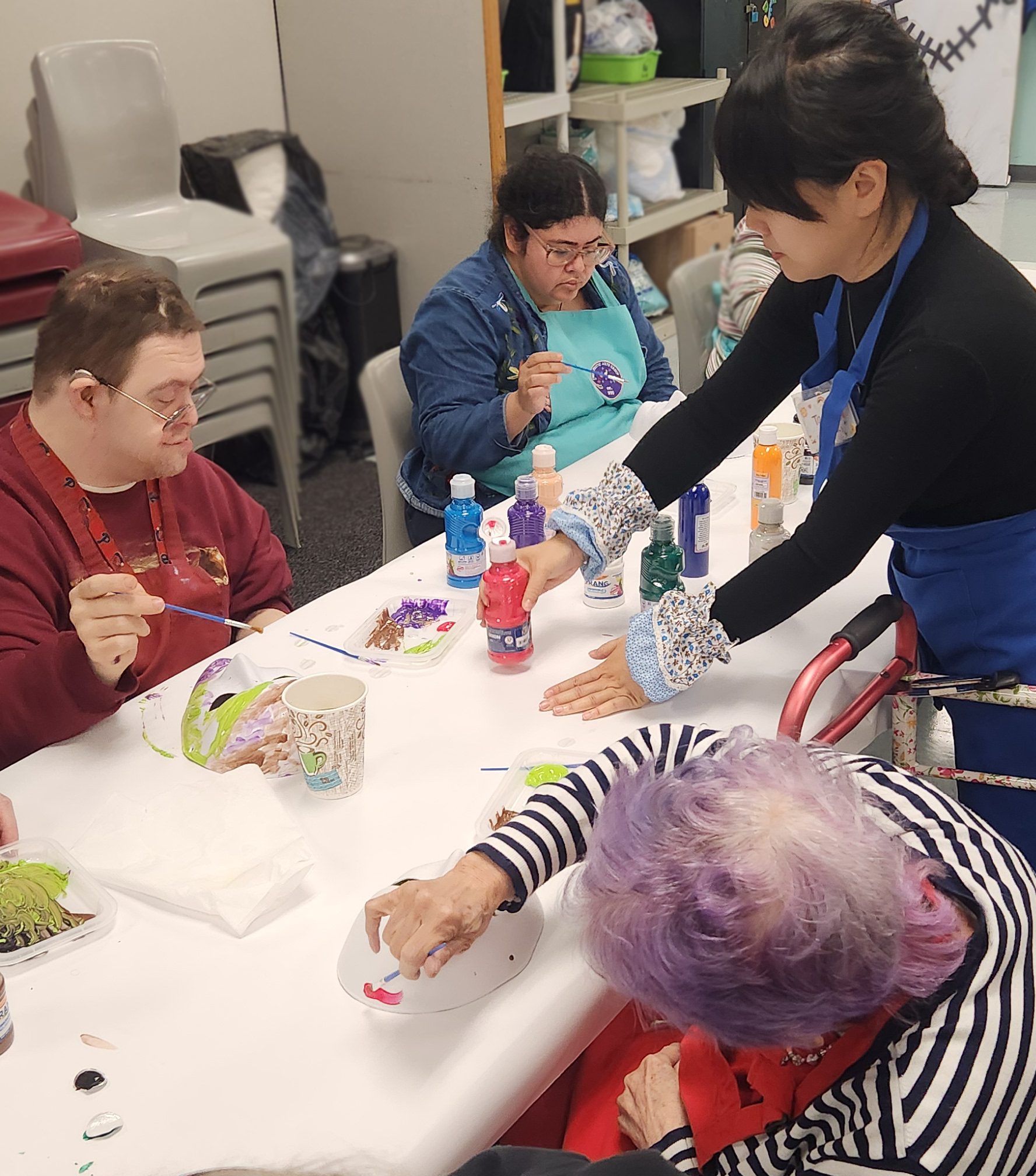 Taoran Xie guiding clients with artwork