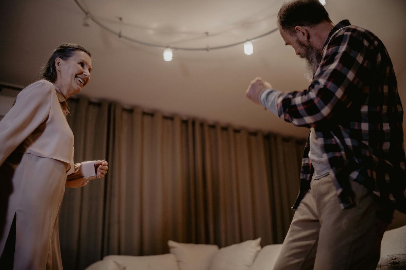 Senior couple energetically dancing